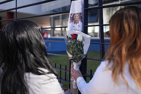 Juan Izquierdo: Fans place flowers by a photo of Uruguayan soccer player Juan Izquierdo